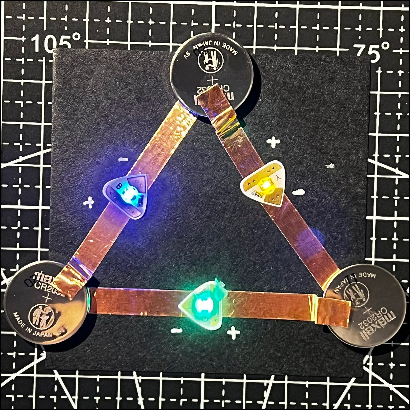 Further experimenting with serial circuits. Batteries placed between each light.