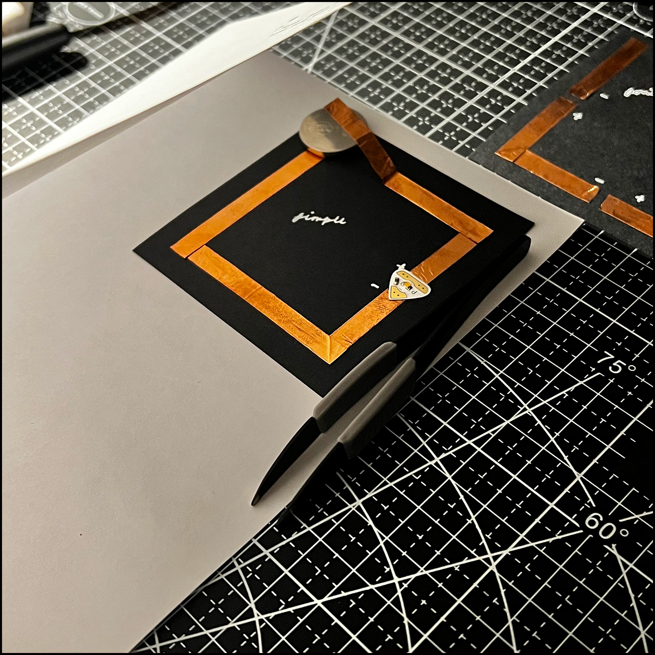 Propped the paper up with small object.