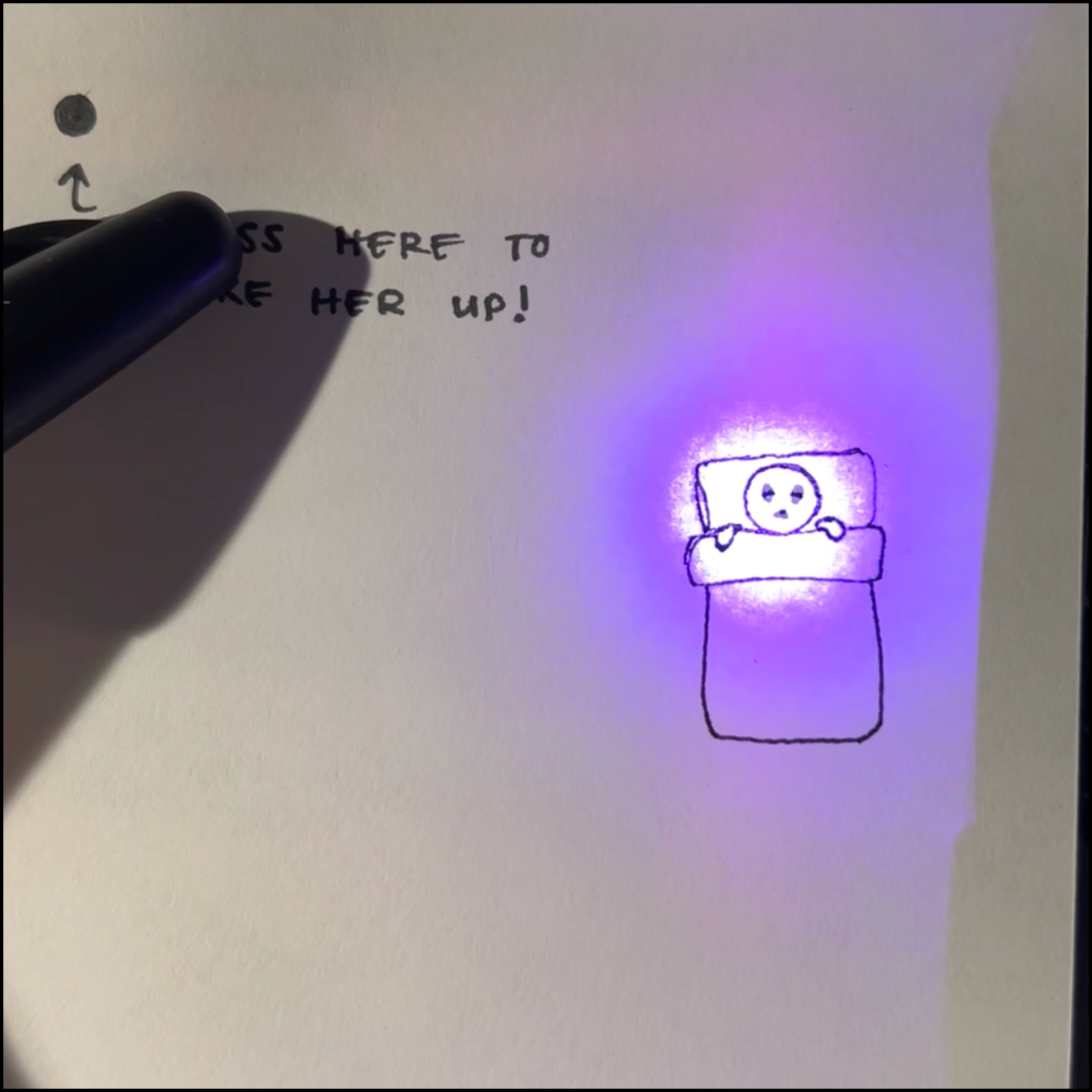 Now with the paper slightly lifted, the light diffuses just enough so the drawing can be seen more clearly.