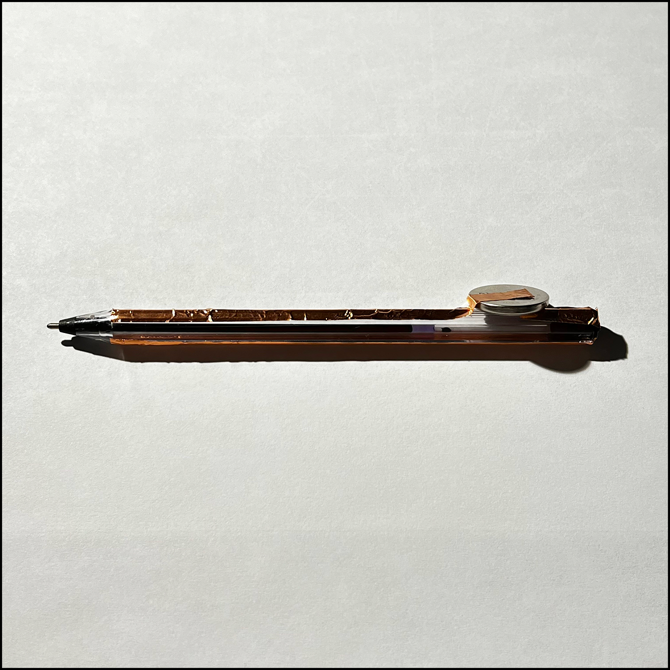Copper tape and battery placed on the stylus part of the pen.