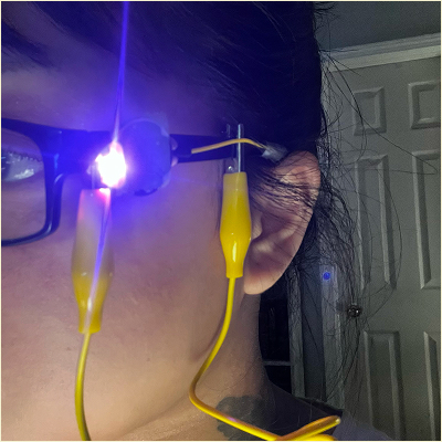 Circuit on the glasses closed when placed on the person's head.